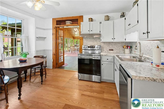 8043 Richlandtown Rd, East Rockhill Twp, PA 18951 - kitchen with stainless steel appliances, a sink, under cabinet range hood, a ceiling fan, and light countertops