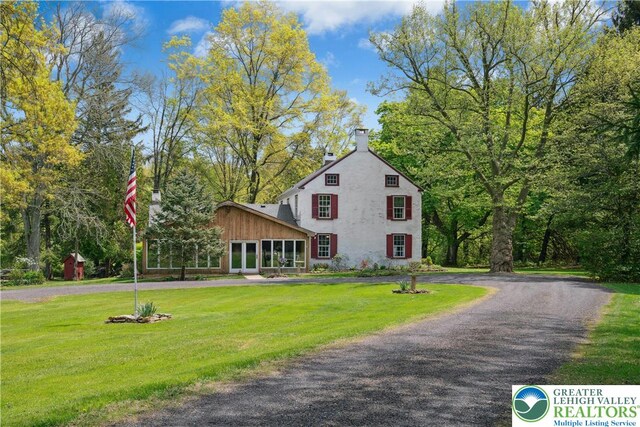8043 Richlandtown Rd, East Rockhill Twp, PA 18951 - view of front of property with a chimney, a front yard, and driveway