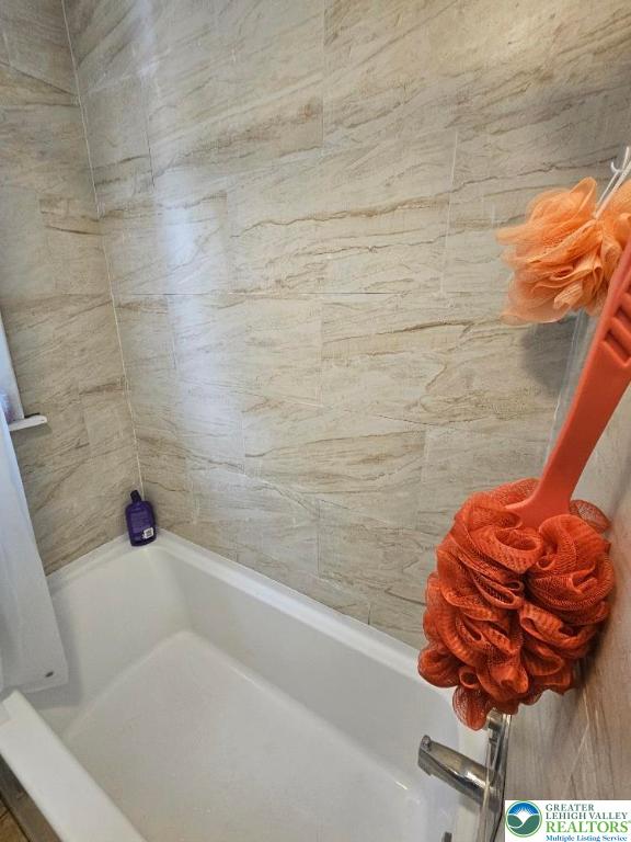 219 N Fountain St, Allentown City, PA 18102 - full bathroom featuring a tub to relax in and a shower