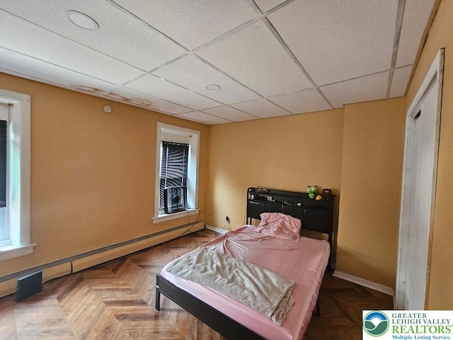219 N Fountain St, Allentown City, PA 18102 - bedroom featuring baseboards, a baseboard radiator, a paneled ceiling, and recessed lighting