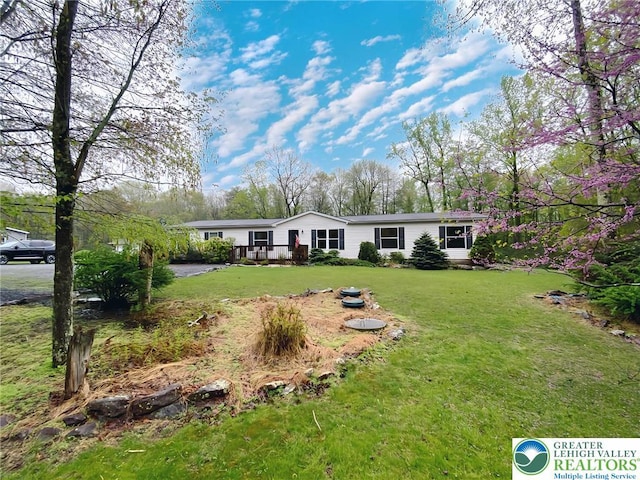 view of front of home with a front lawn