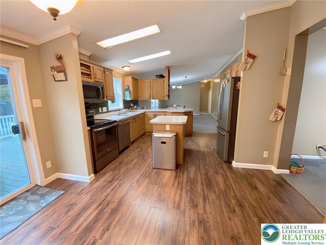 kitchen with stainless steel appliances, ornamental molding, light countertops, dark wood finished floors, and baseboards
