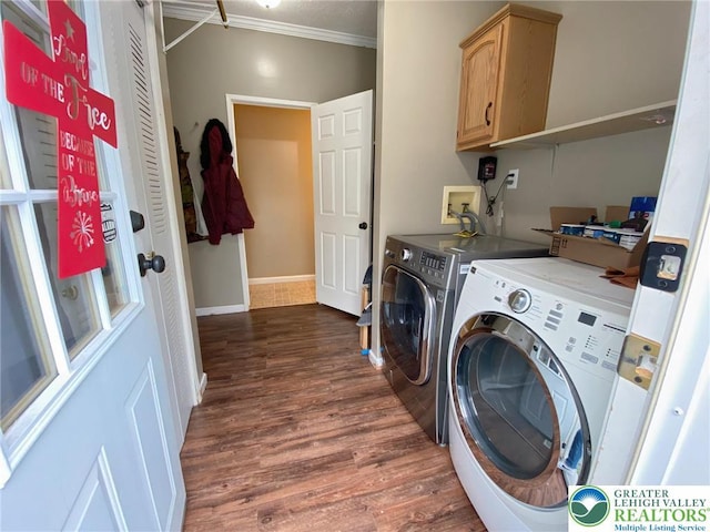 washroom with separate washer and dryer, cabinet space, ornamental molding, dark wood finished floors, and baseboards