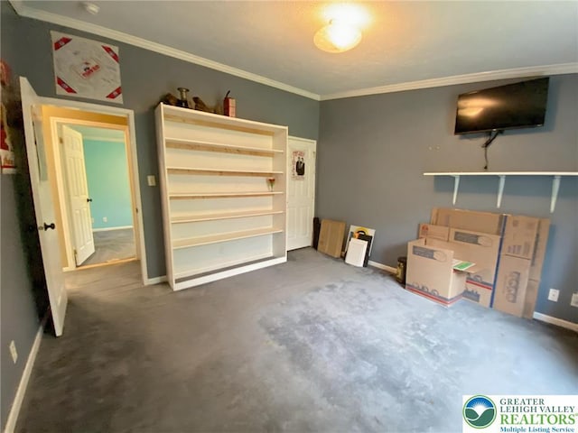 unfurnished living room with crown molding, baseboards, and carpet