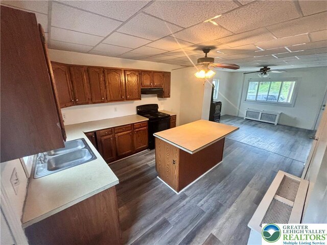 121 E Ridge St, Coaldale Borough, PA 18218 - kitchen with black / electric stove, a sink, light countertops, under cabinet range hood, and ceiling fan