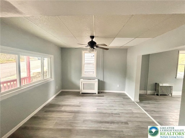 121 E Ridge St, Coaldale Borough, PA 18218 - spare room with ceiling fan, a paneled ceiling, baseboards, and wood finished floors