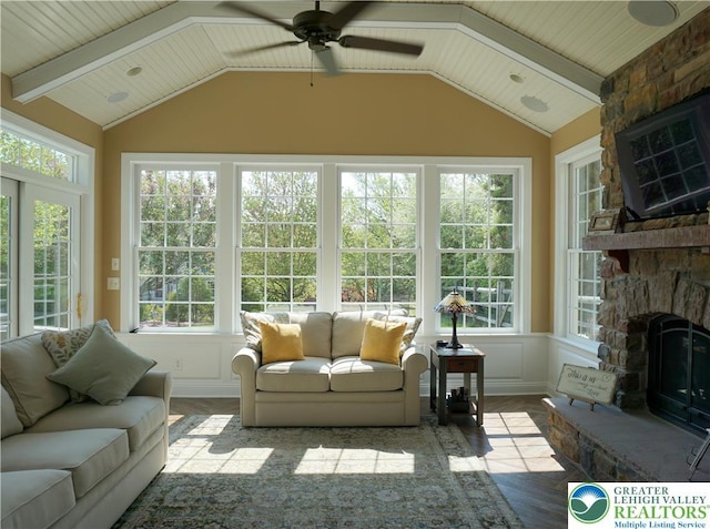 sunroom / solarium with wood finished floors and lofted ceiling