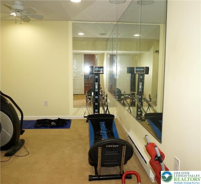 exercise room featuring a baseboard heating unit, a ceiling fan, recessed lighting, carpet, and baseboards