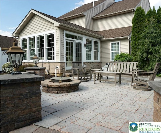 view of patio with a fire pit