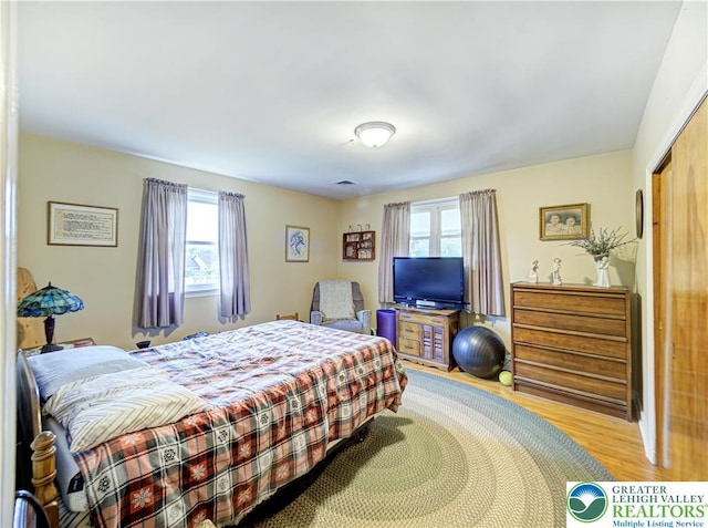 bedroom with wood finished floors