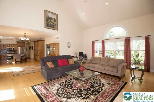 2690 Greens Dr, Lower Saucon Twp, PA 18055 - living area with high vaulted ceiling, a chandelier, light wood finished floors, and recessed lighting