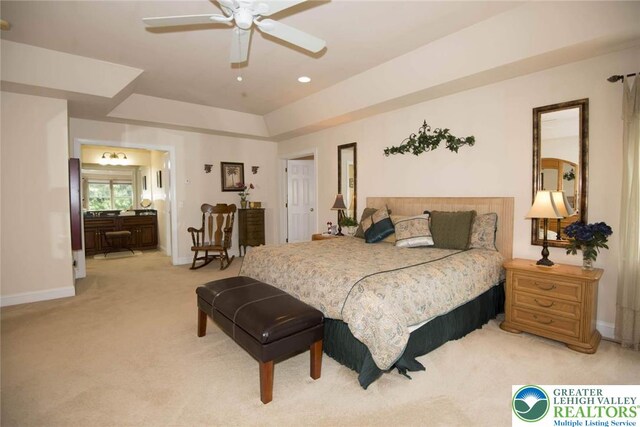 2690 Greens Dr, Lower Saucon Twp, PA 18055 - bedroom with light carpet, baseboards, a raised ceiling, ensuite bathroom, and ceiling fan