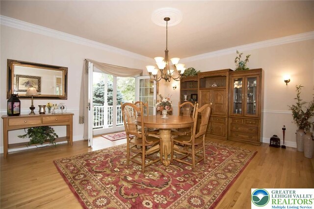 2690 Greens Dr, Lower Saucon Twp, PA 18055 - dining room with a chandelier, light wood-type flooring, and crown molding