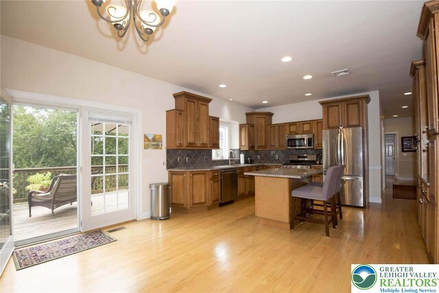 2690 Greens Dr, Lower Saucon Twp, PA 18055 - kitchen with stainless steel appliances, plenty of natural light, a chandelier, tasteful backsplash, and recessed lighting