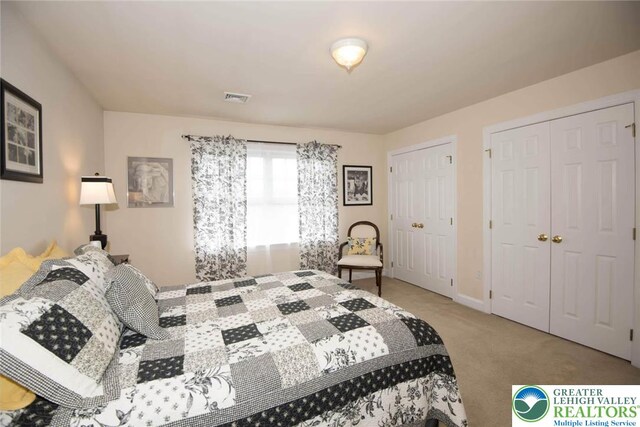 2690 Greens Dr, Lower Saucon Twp, PA 18055 - carpeted bedroom with multiple closets and baseboards