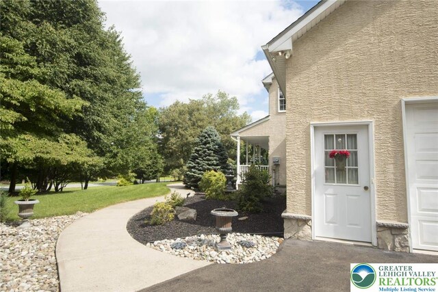 2690 Greens Dr, Lower Saucon Twp, PA 18055 - property entrance with stucco siding and a garage