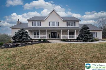 2690 Greens Dr, Lower Saucon Twp, PA 18055 - colonial inspired home featuring a porch, a front yard, and a chimney