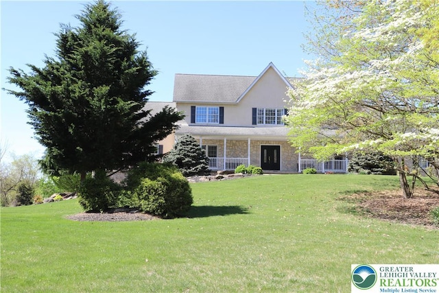 2690 Greens Dr, Lower Saucon Twp, PA 18055 - view of front facade with stone siding, a front lawn, and stucco siding