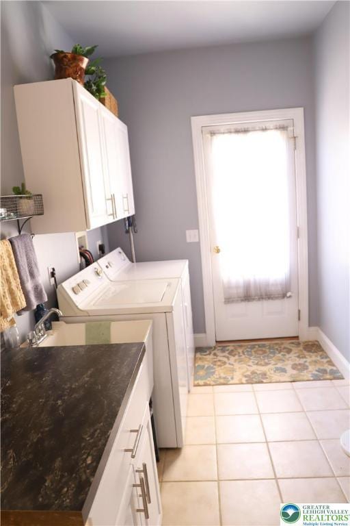 2690 Greens Dr, Lower Saucon Twp, PA 18055 - laundry room featuring washer and clothes dryer, cabinet space, baseboards, and light tile patterned flooring