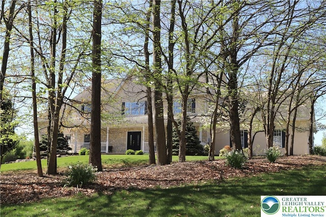 2690 Greens Dr, Lower Saucon Twp, PA 18055 - traditional-style house featuring stone siding and a front lawn