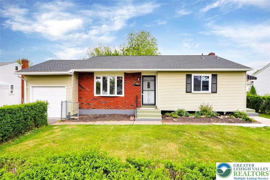 1903 Stonington Rd, Bethlehem City, PA 18018 - ranch-style house with an attached garage, a front yard, and brick siding