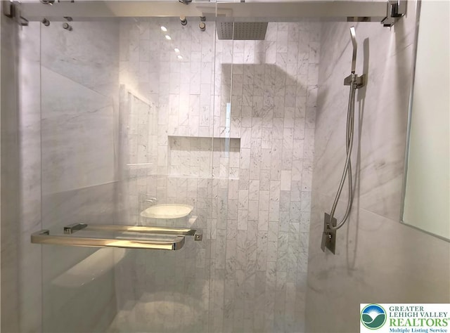 full bathroom with a shower stall