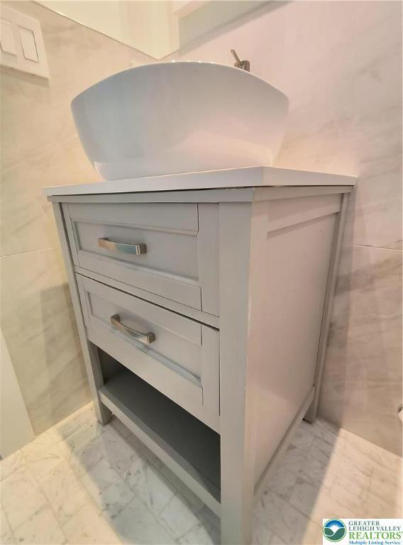 detailed view of tile walls and a sink