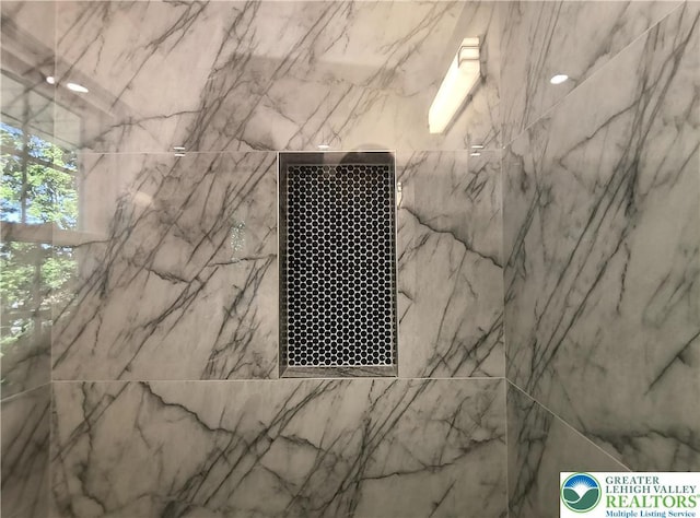 bathroom view of tiled shower