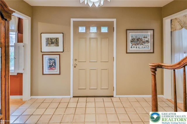 1245 Valley View Dr, Lower Macungie Twp, PA 18103 - entrance foyer featuring baseboards, light tile patterned floors, and stairway