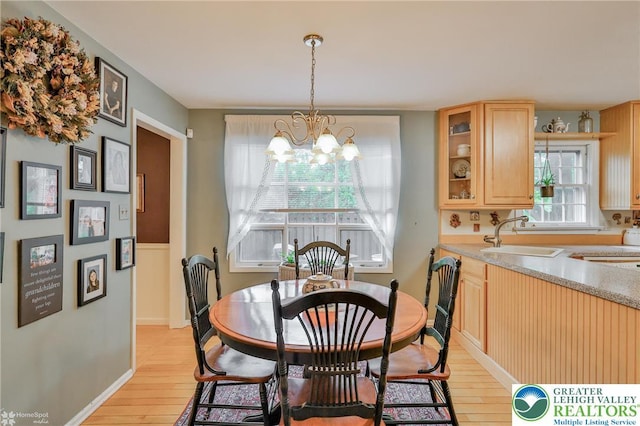 1245 Valley View Dr, Lower Macungie Twp, PA 18103 - dining area with a chandelier, light wood-type flooring, and baseboards