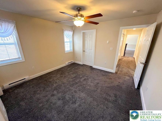 unfurnished bedroom with a baseboard radiator, dark carpet, ceiling fan, and baseboards