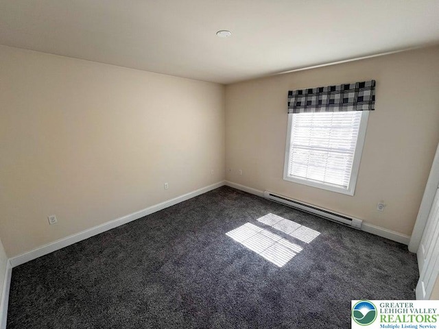 unfurnished room with a baseboard radiator, dark carpet, and baseboards