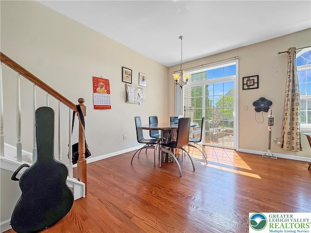 4527 Bellflower Way, Upper Macungie Twp, PA 18104 - dining space with a chandelier, plenty of natural light, wood finished floors, and baseboards