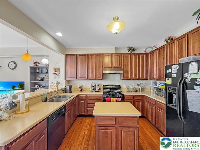 4527 Bellflower Way, Upper Macungie Twp, PA 18104 - kitchen featuring black appliances, a sink, under cabinet range hood, and light wood-style floors