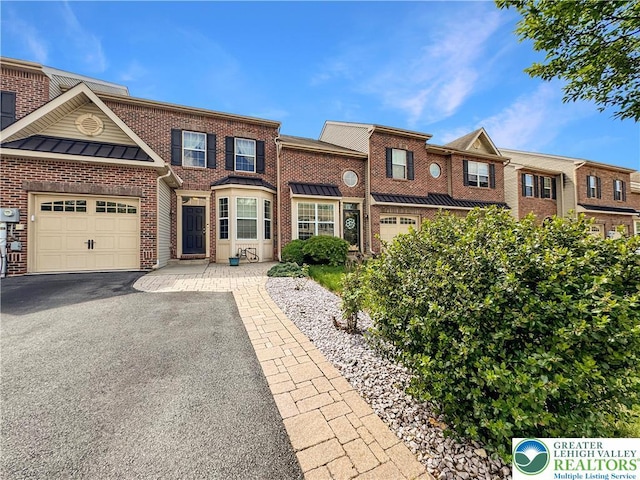 4527 Bellflower Way, Upper Macungie Twp, PA 18104 - view of property with a garage, a standing seam roof, driveway, and brick siding
