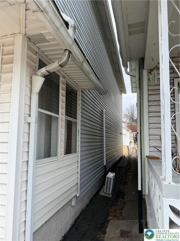 view of home's exterior featuring a cooling unit