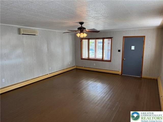 unfurnished living room featuring a baseboard radiator, a ceiling fan, a wall mounted air conditioner, dark wood-style flooring, and baseboards