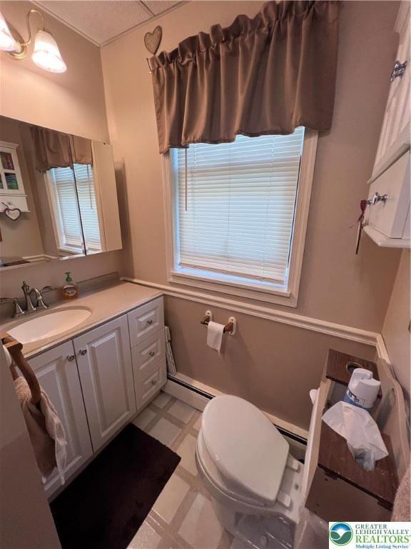 bathroom featuring vanity, toilet, and tile patterned floors
