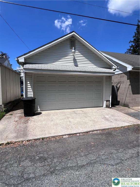 garage featuring driveway