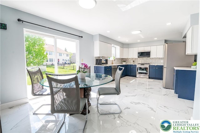 dining space with plenty of natural light