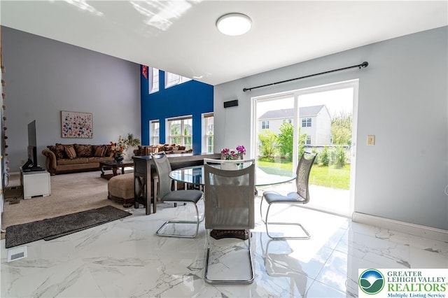 dining room featuring marble tiled floors
