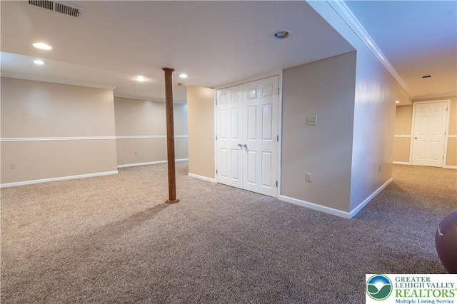 finished basement with crown molding, carpet flooring, baseboards, and recessed lighting