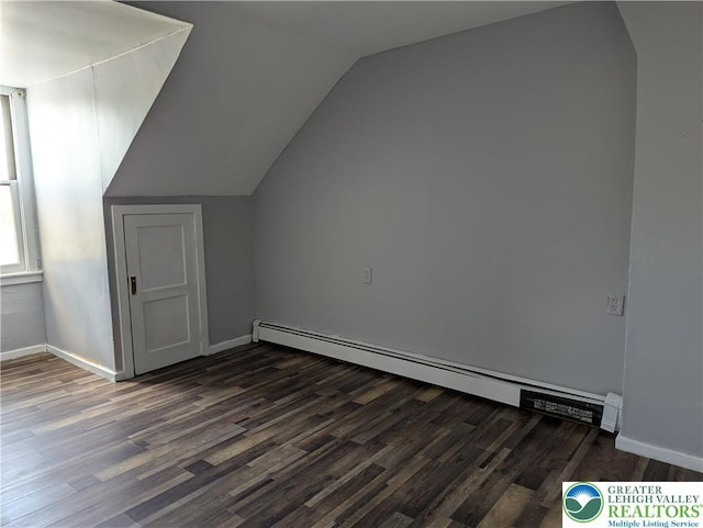 1616 W Tilghman St, Allentown City, PA 18102 - additional living space with a baseboard heating unit, dark wood-type flooring, lofted ceiling, and baseboards