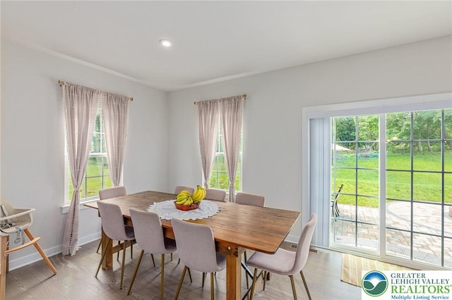 dining room with baseboards, recessed lighting, and light wood-type flooring