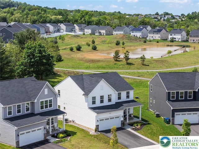 aerial perspective of suburban area with a large body of water