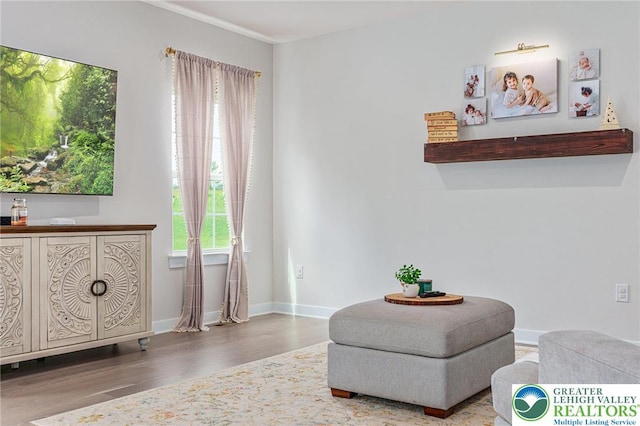 sitting room featuring wood finished floors and baseboards