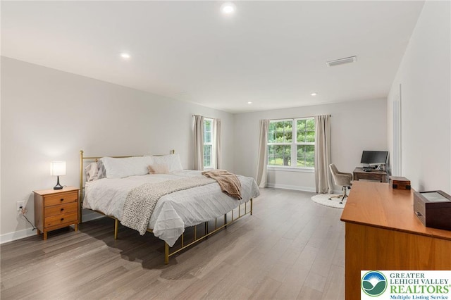 bedroom with a desk, light wood-style flooring, baseboards, and recessed lighting