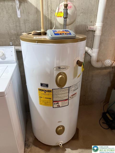 utilities featuring washer / clothes dryer and water heater