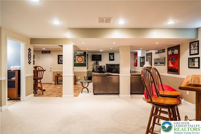 living room featuring light colored carpet, recessed lighting, and baseboards