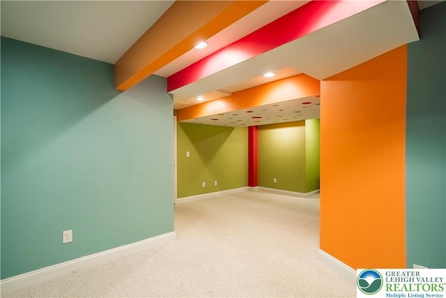 finished basement featuring carpet, baseboards, and recessed lighting
